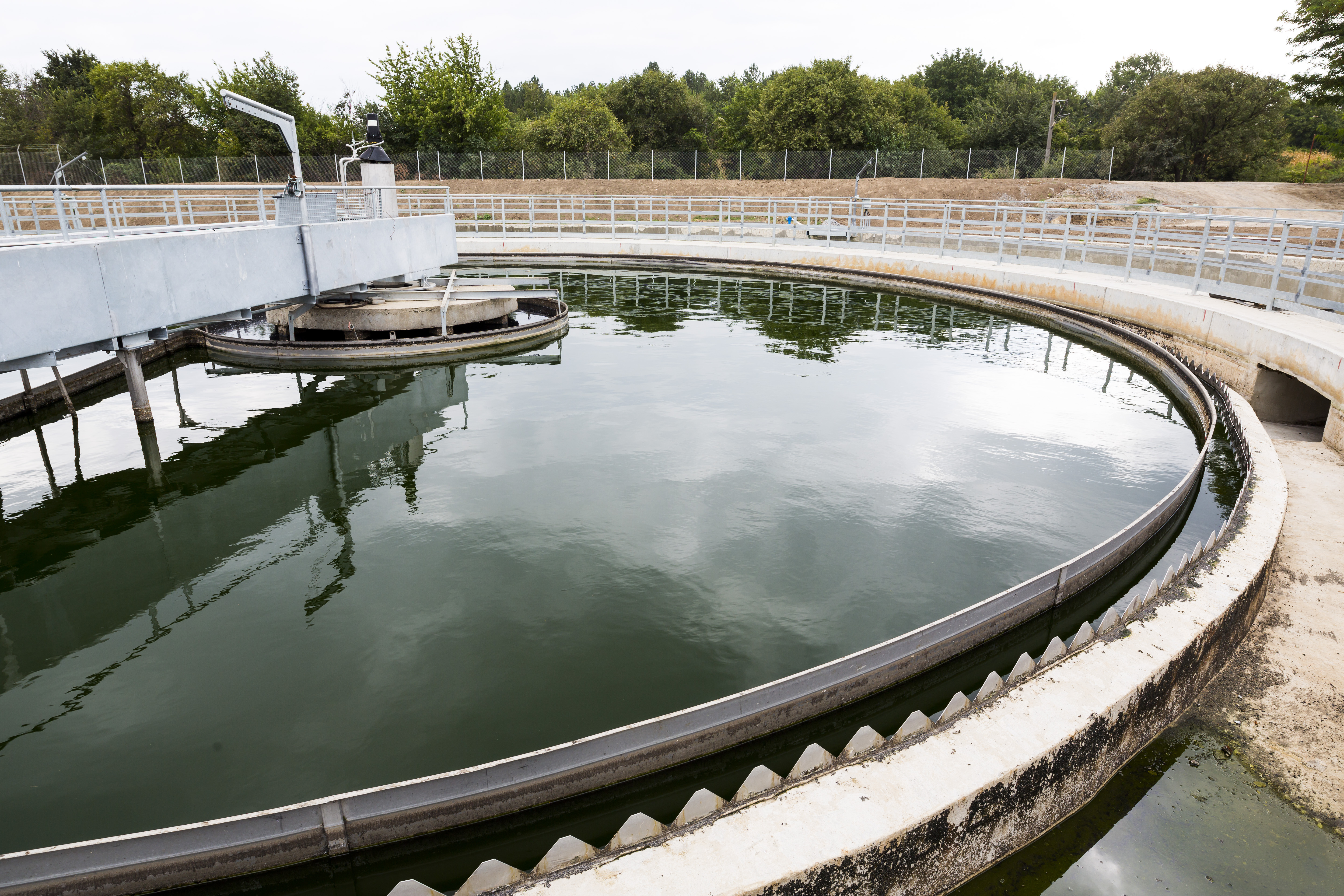 Circular clarifier basin at a wastewater treatment facility